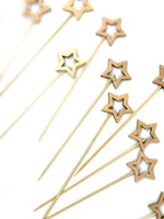 Toppers - gold stars 12 pc تغريسات النجوم الخشبية